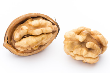 Walnut and walnut kernel isolated on the white background.