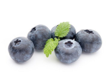 Close up of a blueberry branch isolated over white.