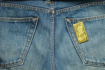 Fototapeta premium The gold bar put in the jean pocket background represent gold and business finance concept related idea.