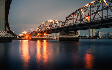 Iron bridge over the river at night