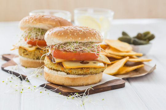 Vegan burger with quinoa, tomato and sprouts