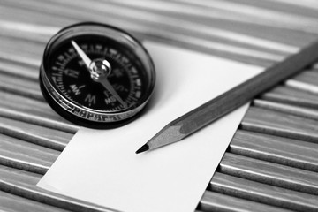 Plastic compass and paper for notes