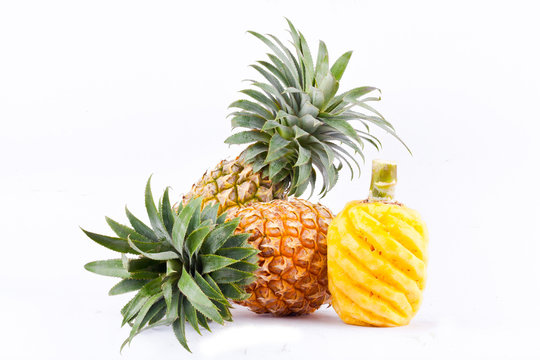 peeled  pineapple and fresh ripe pineapple have sweet taste  on white background healthy pineapple fruit food isolated
