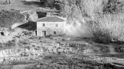 Cascate del Mulino, natural limestone pools and free spas in Saturnia, Grosseto, Tuscany, Italy, in black and white