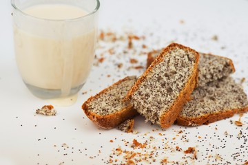 Poppy seed cake, glass of fermented milk.