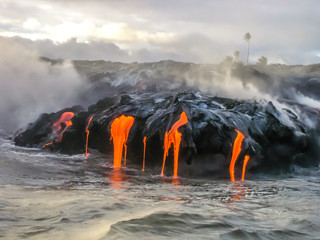 Sea view of Kilauea Volcano in Big Island, Hawaii, United States. A restless volcano that has been...