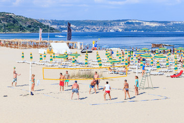 People playing volleyball at beach. Leisure at Black Sea. Resort Albena, Bulgaria