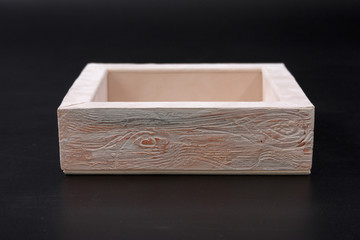 an empty box on a black background. casket.