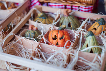 Many pumpkins on the wooden box