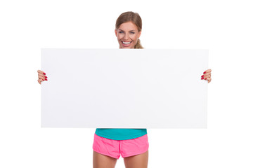 Fototapeta premium Smiling Woman Holding Banner