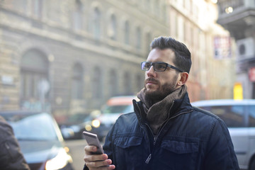 Man with phone in the city