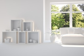Fototapeta na wymiar White room with sofa and green landscape in window. Scandinavian interior design