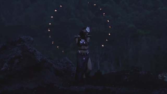 Woman dancing with fire in the volcano Batur, Bali, Indonesia. Slow-motion 