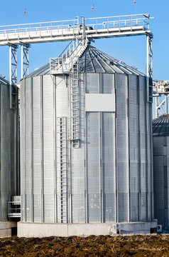 The complex silo installations for the storage of grain standing in the plowed