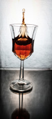 wine splashing in a glass