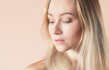 Naklejka premium Beautiful young woman with blue eyes. Color toned image.