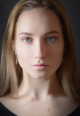 Obraz premium Portrait of a beautiful young woman with blue eyes.