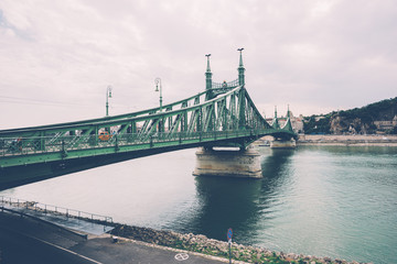 Fototapeta premium View of in a cloudy day of Liberty Bridge (Chain Bridge) over Danube river in Budapest