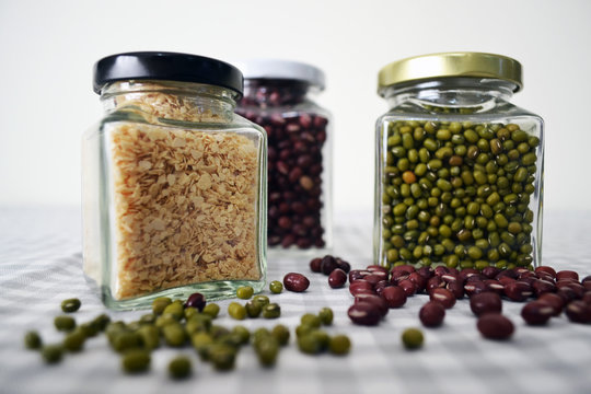 Beans and grains in square glass jar