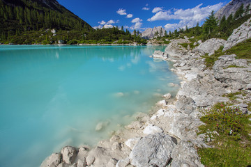 Amazing view of Sorapis lake with unusual color of water. Lake located in Dolomite Alps, Italy