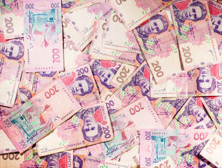 Paper money bills Ukrainian hryvnia poured background