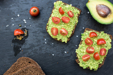 Bruschetta with avocado, cherry tomatoes and spices