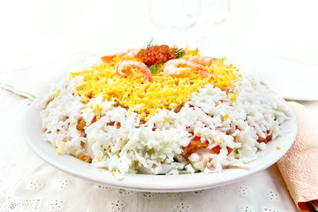 Salad of salmon and seafood on light board