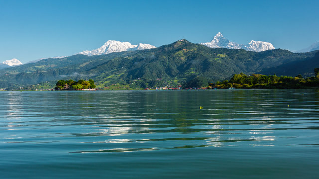 The Machapuchare and Annapurna range seen from Phewa Lake in Pokhara, Nepal