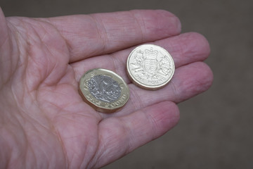 New and old design of british pound sterling coin