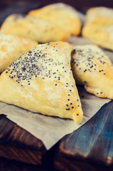 Triangular cookies with poppy seeds