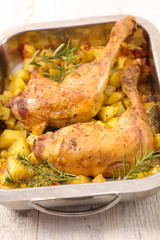 roasted chicken leg and potatoes