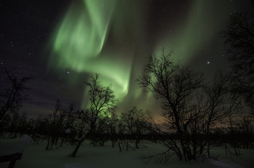 Northern lights in lapland landscape in Finland