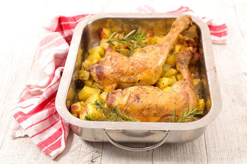 roasted chicken leg and potatoes