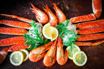 seafood on black. crab and  shrimps on dark background. delicious cooked shrimp with an...