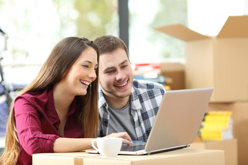 Couple buying online while moving home