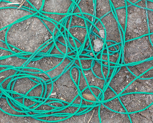 Pile of green rope on the ground