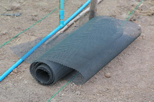 Roll of plastic wire mesh on ground