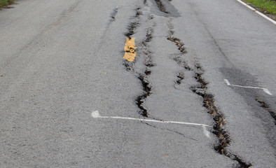 cracked asphalt background, low quality surface street