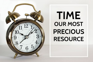 Text Time our most precious resource on clock background / time concept