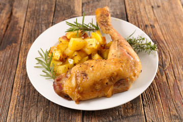 roasted chicken leg and potatoes