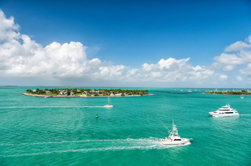 touristic yachts floating by green island at Key West, Florida