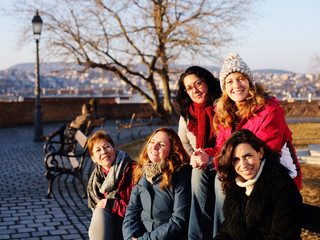 Outdoor portrait of happy woman walking on Budapest