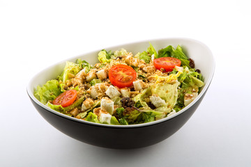 Lettuce salad tomato cheese and nuts