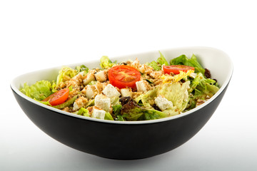 Lettuce salad tomato cheese and nuts