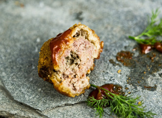 Homemade meat cutlets with parsley, ketchup and bread on white plate