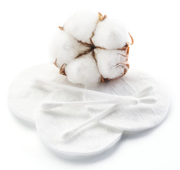 Fluffy cotton ball and cotton swabs and pads.