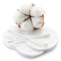 Fluffy cotton ball and cotton swabs and pads.