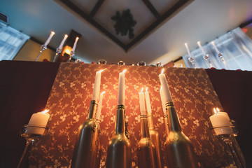 Dinner in the restaurant. Candles on the table. Banquet hall. The wedding feast