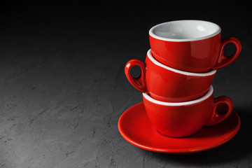 Empty coffee cups on stone background