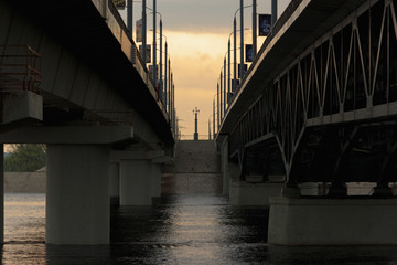 Gomel, Belarus - sunset between the two bridges over the river.